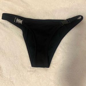 Clasped black swim bottoms